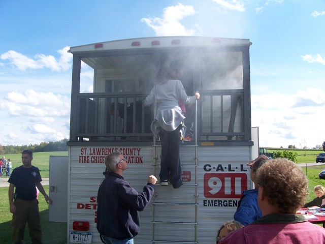 Canton FF Jim Belonge help children down the ladder at Harvest Fest 2006